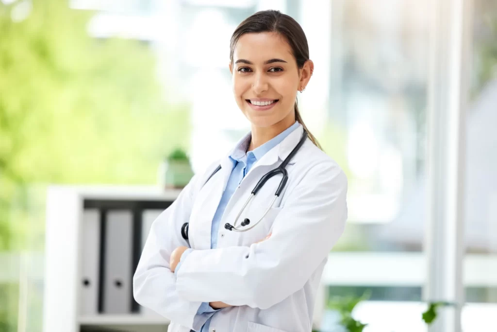 confident young mixed race female doctor standing utc